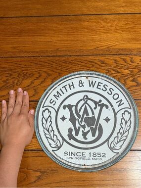 Collectable vintage Smith & Wesson Round Metal Wall Plaque